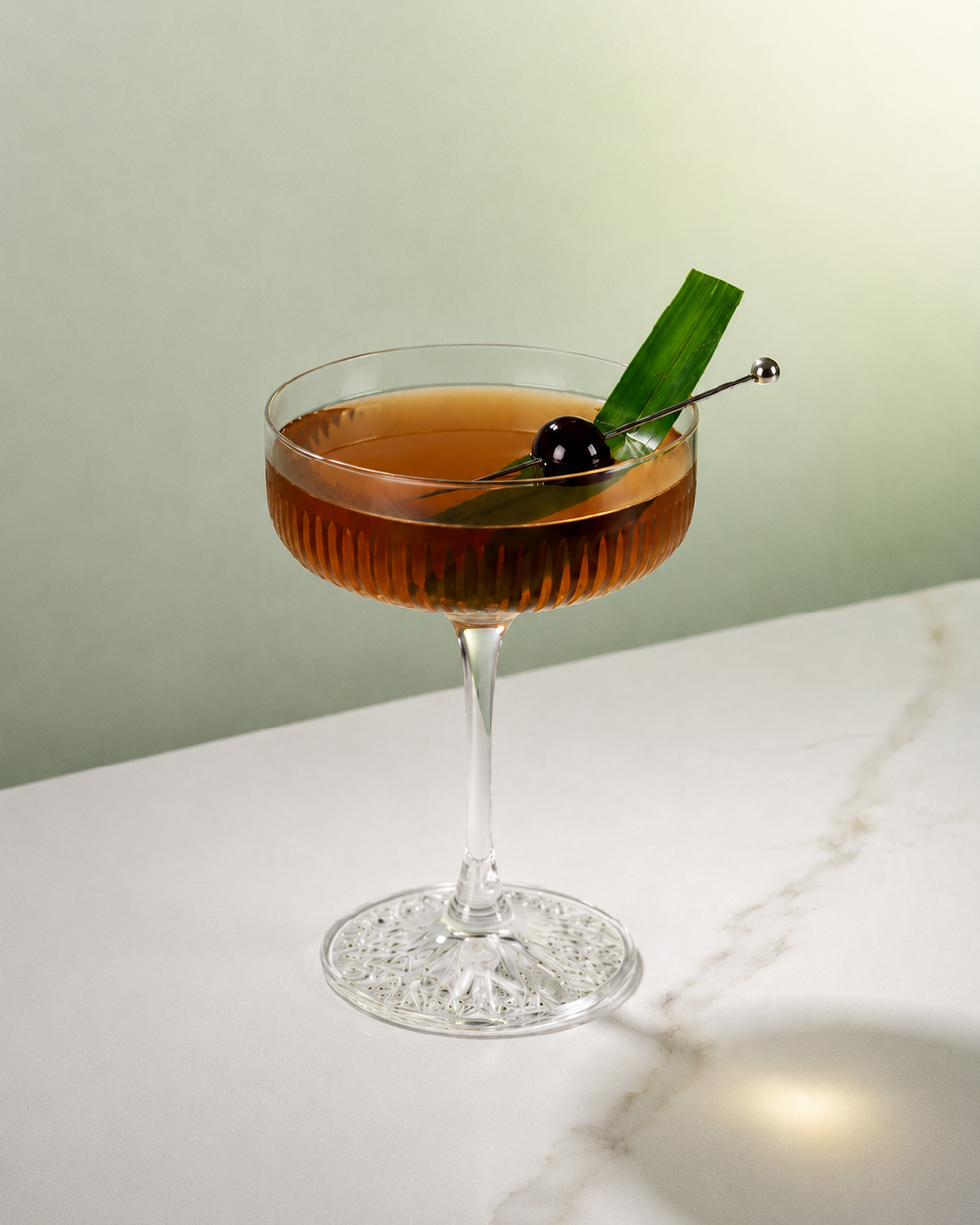 Pandan sour cocktail with Bandoeng'22 pandan liqueur and egg white foam