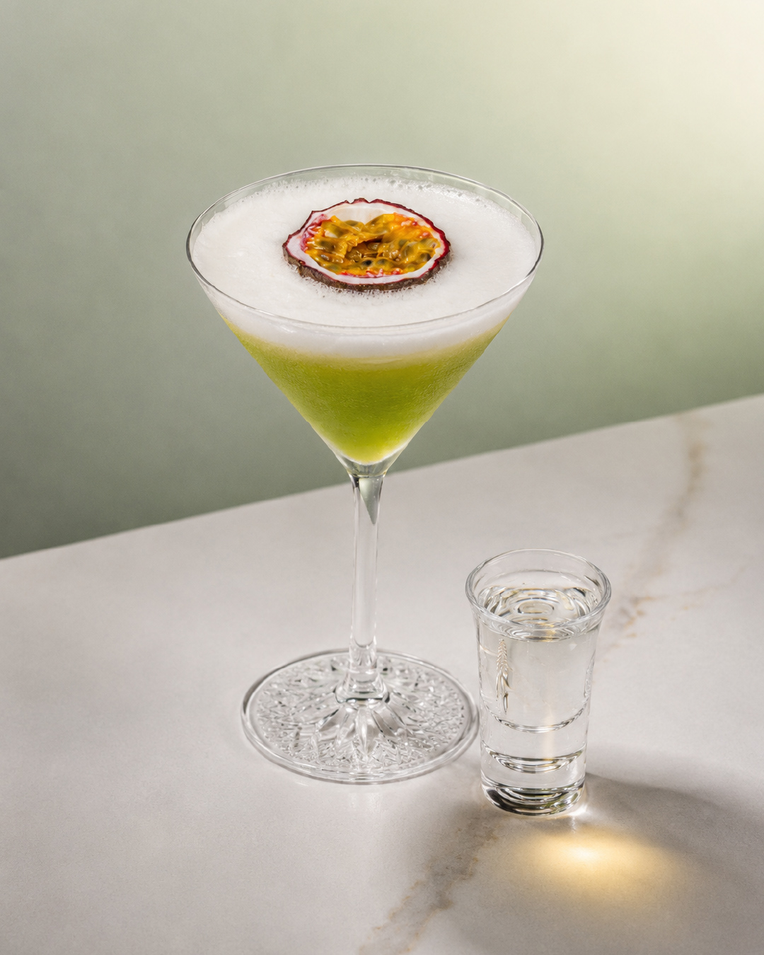 Pandan Pornstar Martini cocktail with Bandoeng'22 pandan liqueur and passion fruit