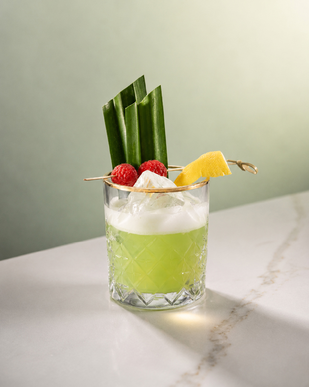 Pandan sour cocktail with Bandoeng'22 pandan liqueur and egg white foam